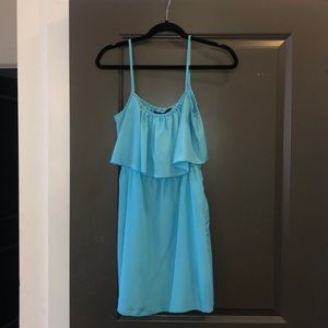 Blue spaghetti strap dress.